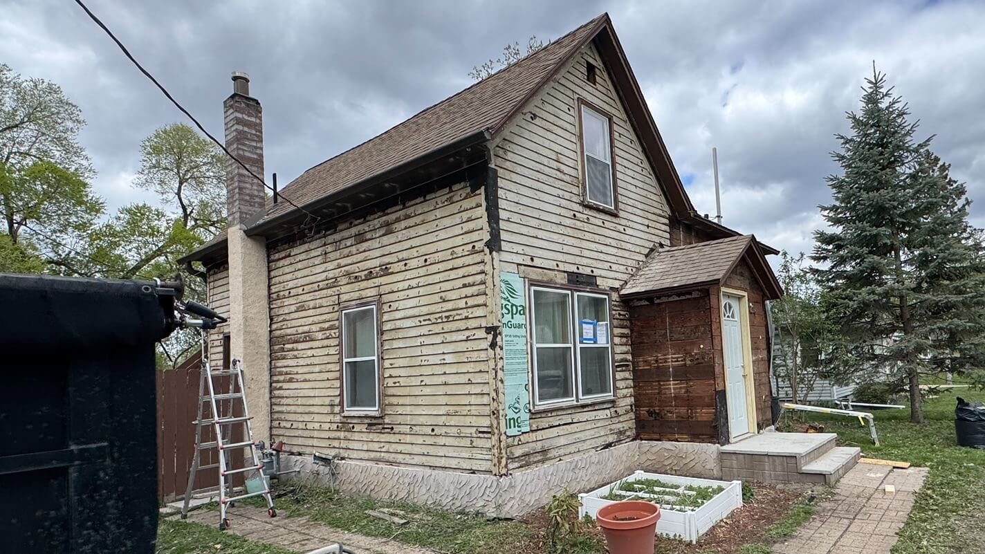 Forest Lake, MN home siding stripped to reveal rot during exterior restoration