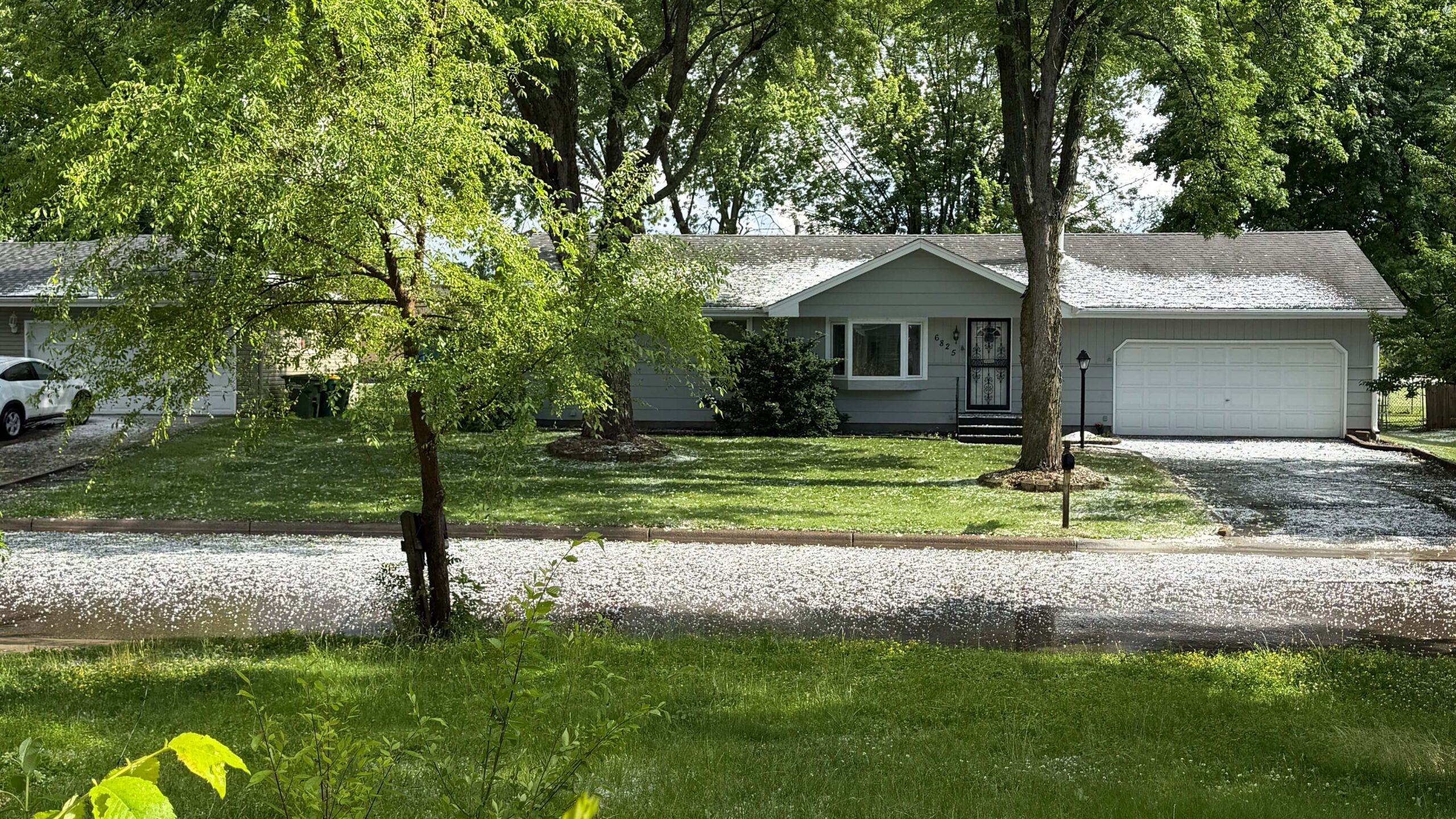 Brooklyn Park, MN house roof covered in one inch hail after storm