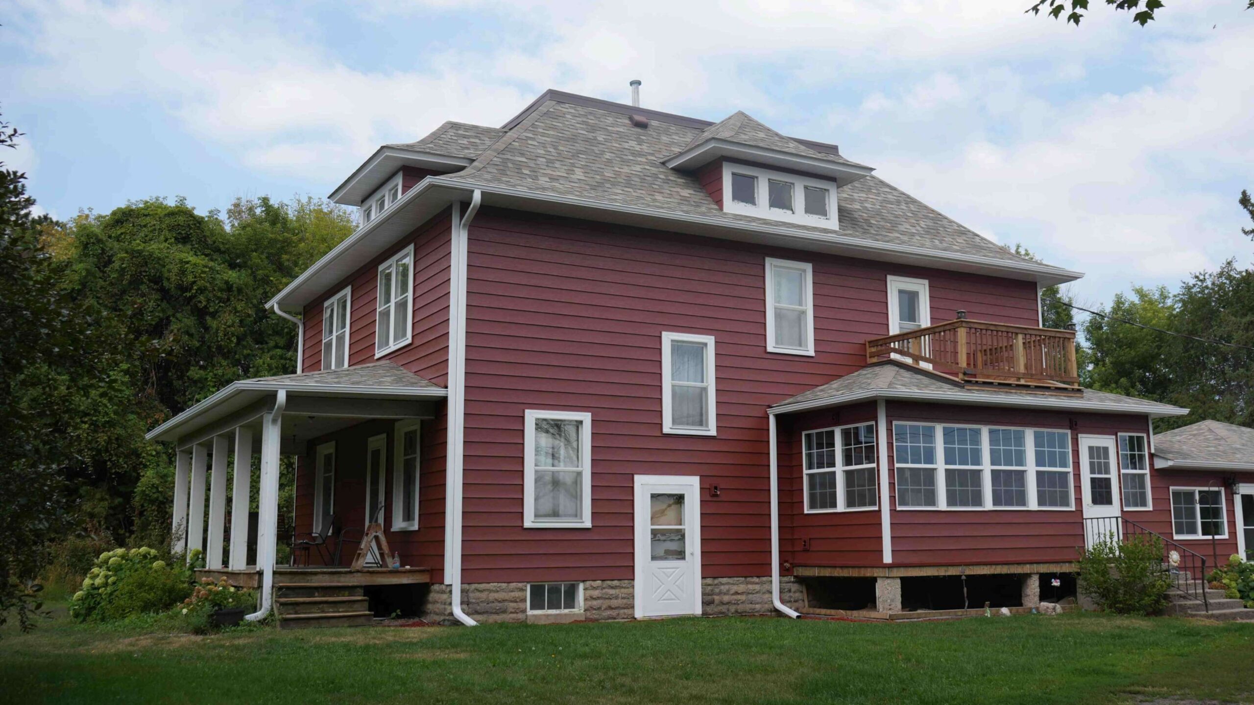 Minnesota Exterior Company installed LP smart side on house and attached garage in a classic red