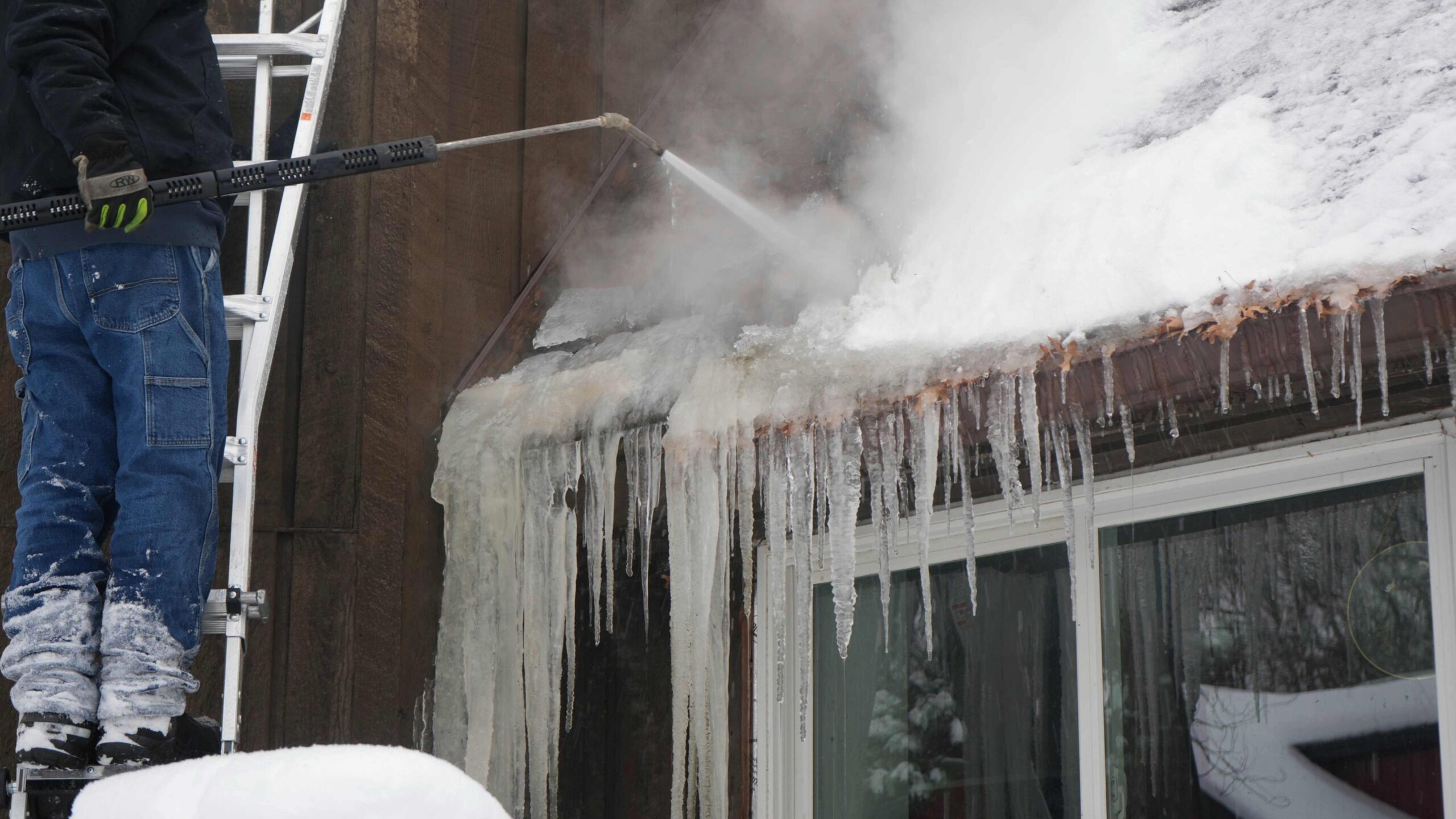 Large ice dam on East Bethel, MN home removed by Minnesota General Contractor with high temp, low pressure steamer 