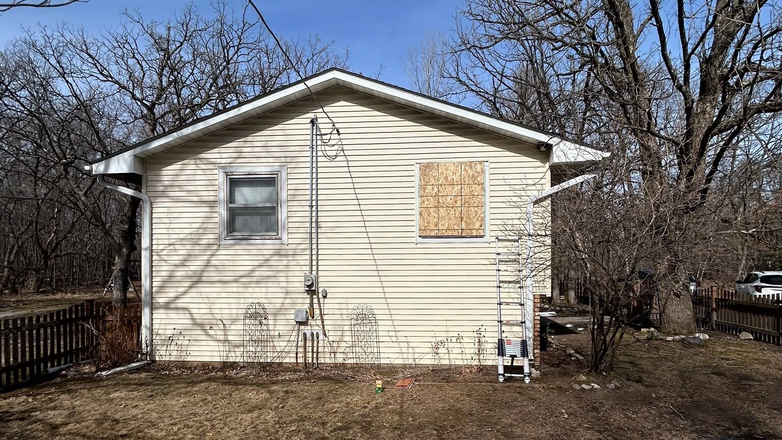 General Contractor boarded up small rambler window in Stacy, MN