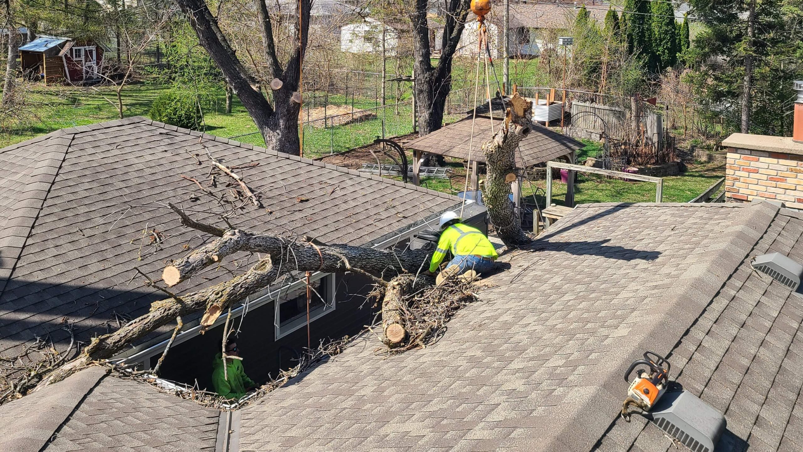 Minnesota Exterior Company removing fallen tree on Twin Cities home