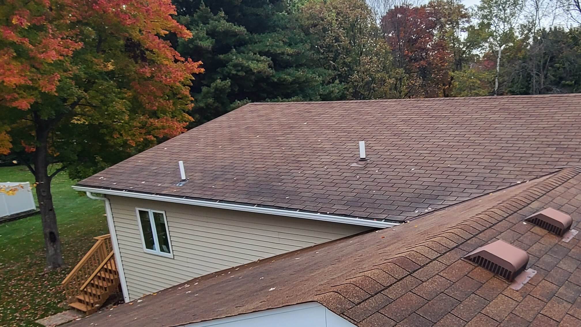 Wyoming, MN roof with discolored shingles prior to full roof replacement