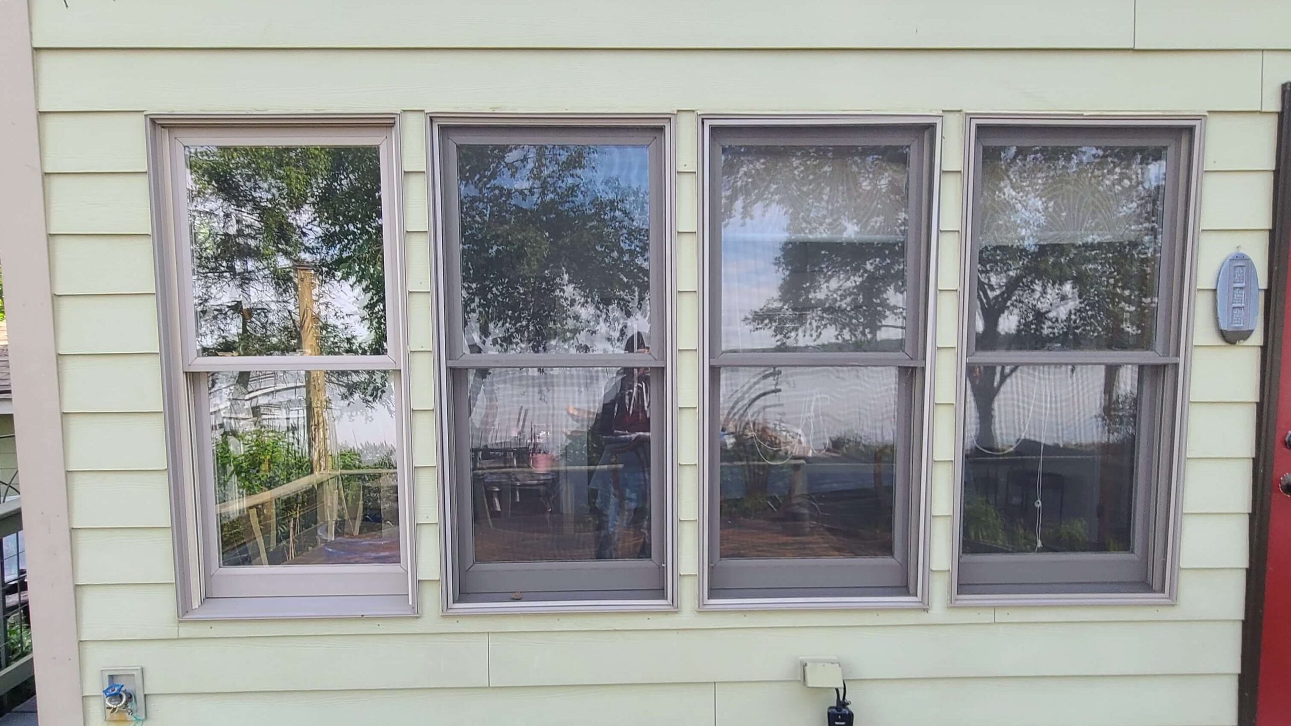 Twin Cities General Contractor inspecting Wyoming, MN home prior to installing over 20 new windows
